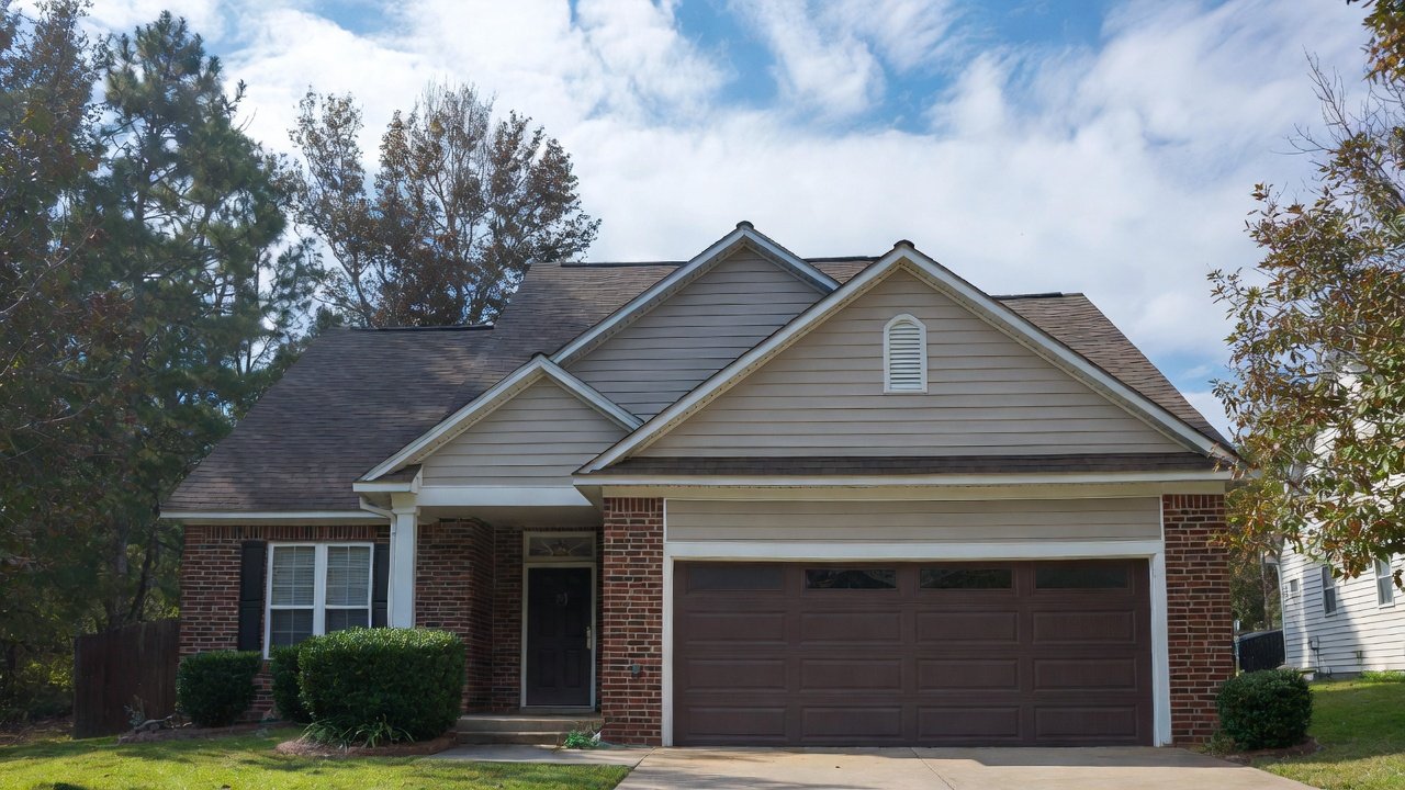 North Alabama brick ranch home with brown double garage door